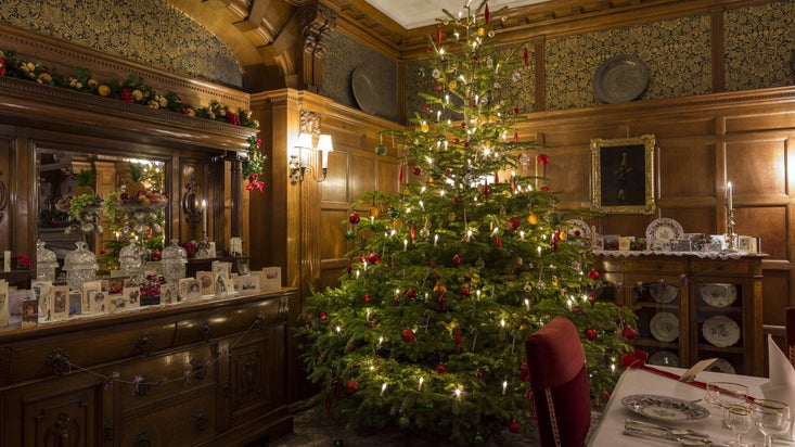Christmas tree in the decorated dining room at Lanhydrock, Cornwall